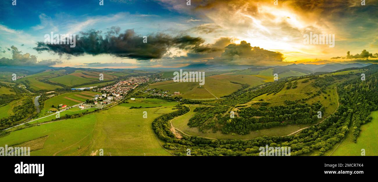 Aerial drone view of Podolinec, the town near Stara Lubovna, Slovakia, during sunset Stock Photo
