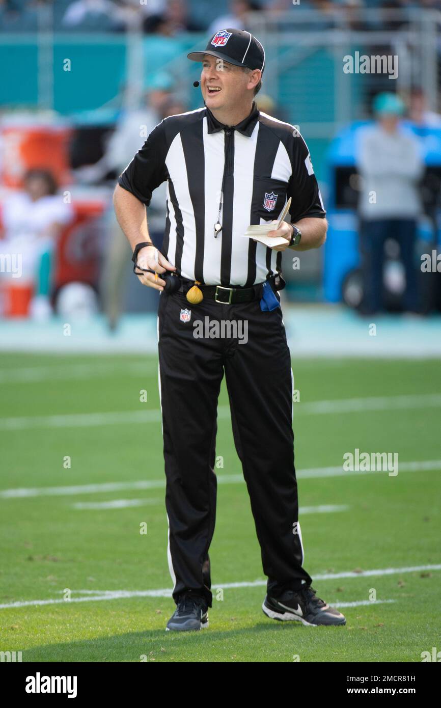NFL side judge Allen Baynes stands on the field during an NFL football