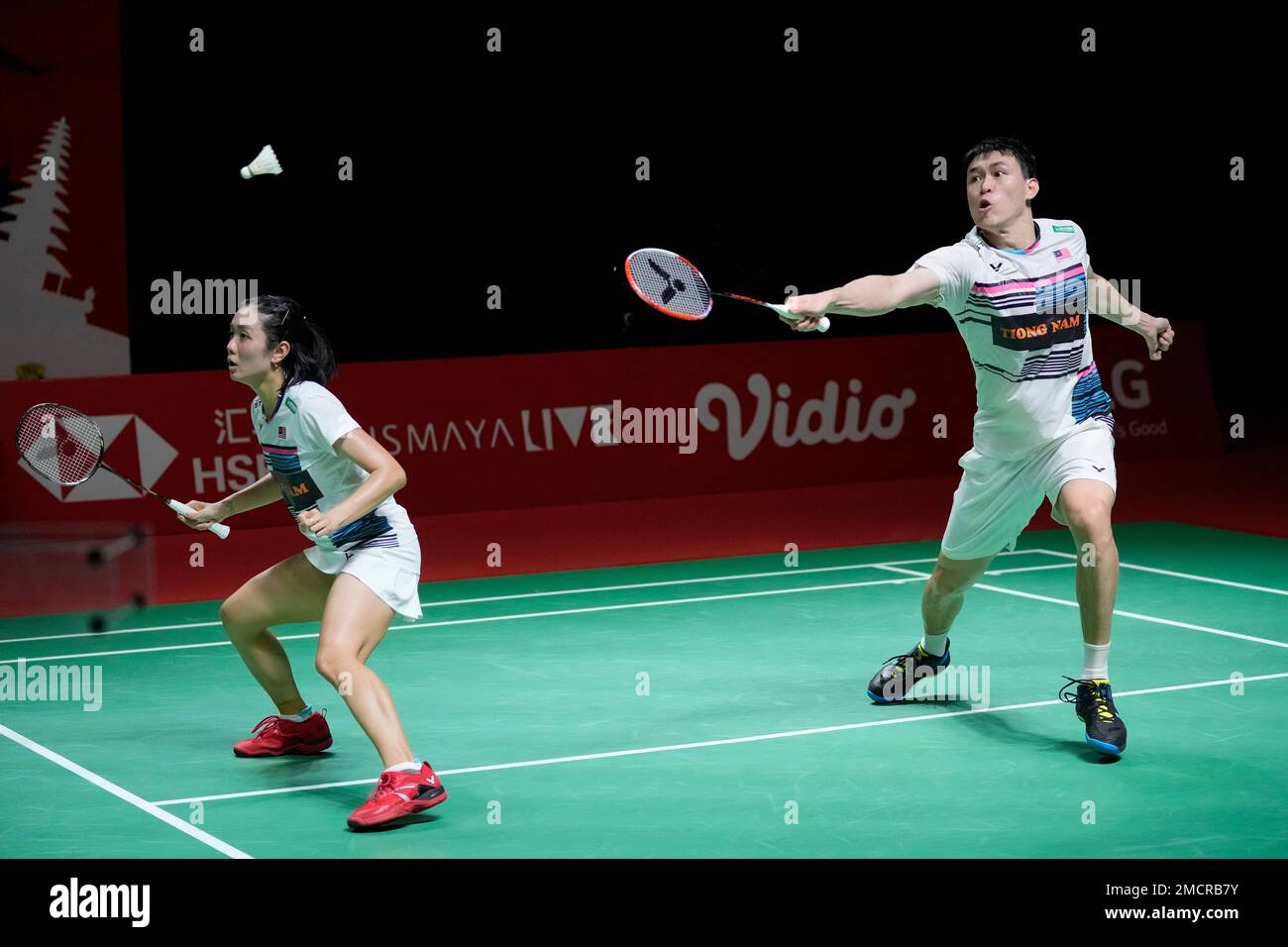 Denmarks Mathias Christiansen, right, and Alexandra Boje compete against Malaysias Tan Kian Meng and Lai Pei Jing during their mixed doubles first round match at Indonesia Open badminton tournament at Istora Gelora