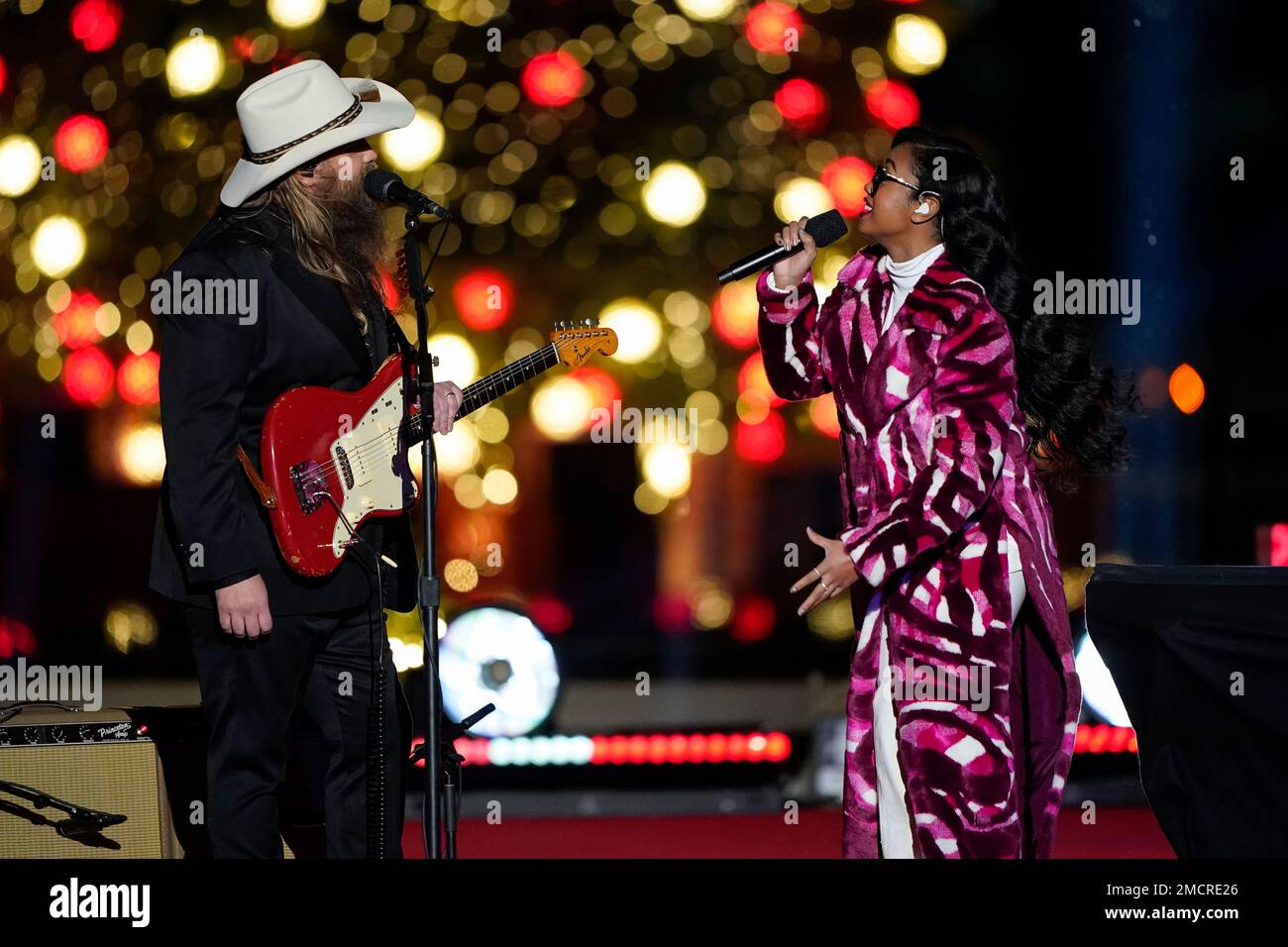 Chris Stapleton and H.E.R. perform as President Joe Biden and first