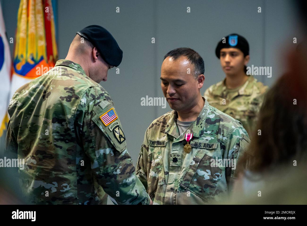 U.S Army Col. Chirstopher S. McClure, 1st Theater Signal Brigade Commander pinning Lt. Col. Sirian Thepsoumane the U.S. Army Meritorious Service Medal at the 1st Theater Signal Brigade Headquarters in Camp Humphreys, South Korea on July 8, 2022.  Thepsoumane was recognized for his services as the United States Army Communications Information Systems Activity Pacific Director. Stock Photo