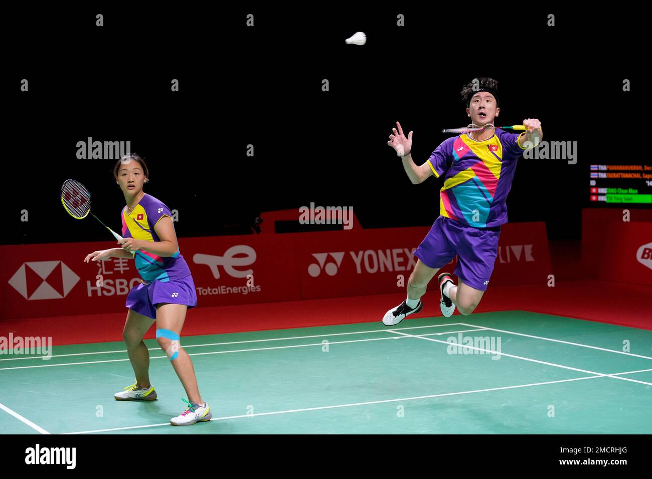 Hong Kongs Tang Chun Man, right, and Tse Ying Suet compete against Thailands Dechapol Puavaranukroh and Sapsiree Taerattanachai during their mixed doubles badminton group stage match at the BWF World Tour Finals