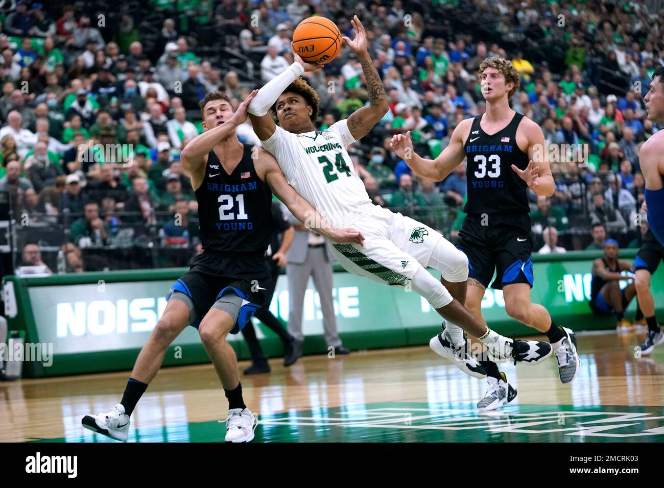 Utah Valley guard Justin Harmon (24) goes to the basket as BYU guard