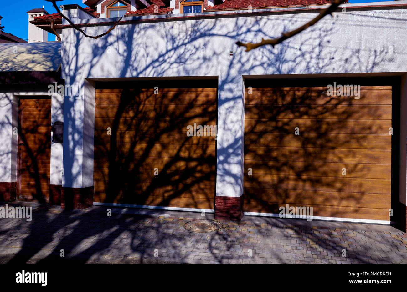 Modern duplex garage door. Large automatic up and over door. Close up photo, natural light