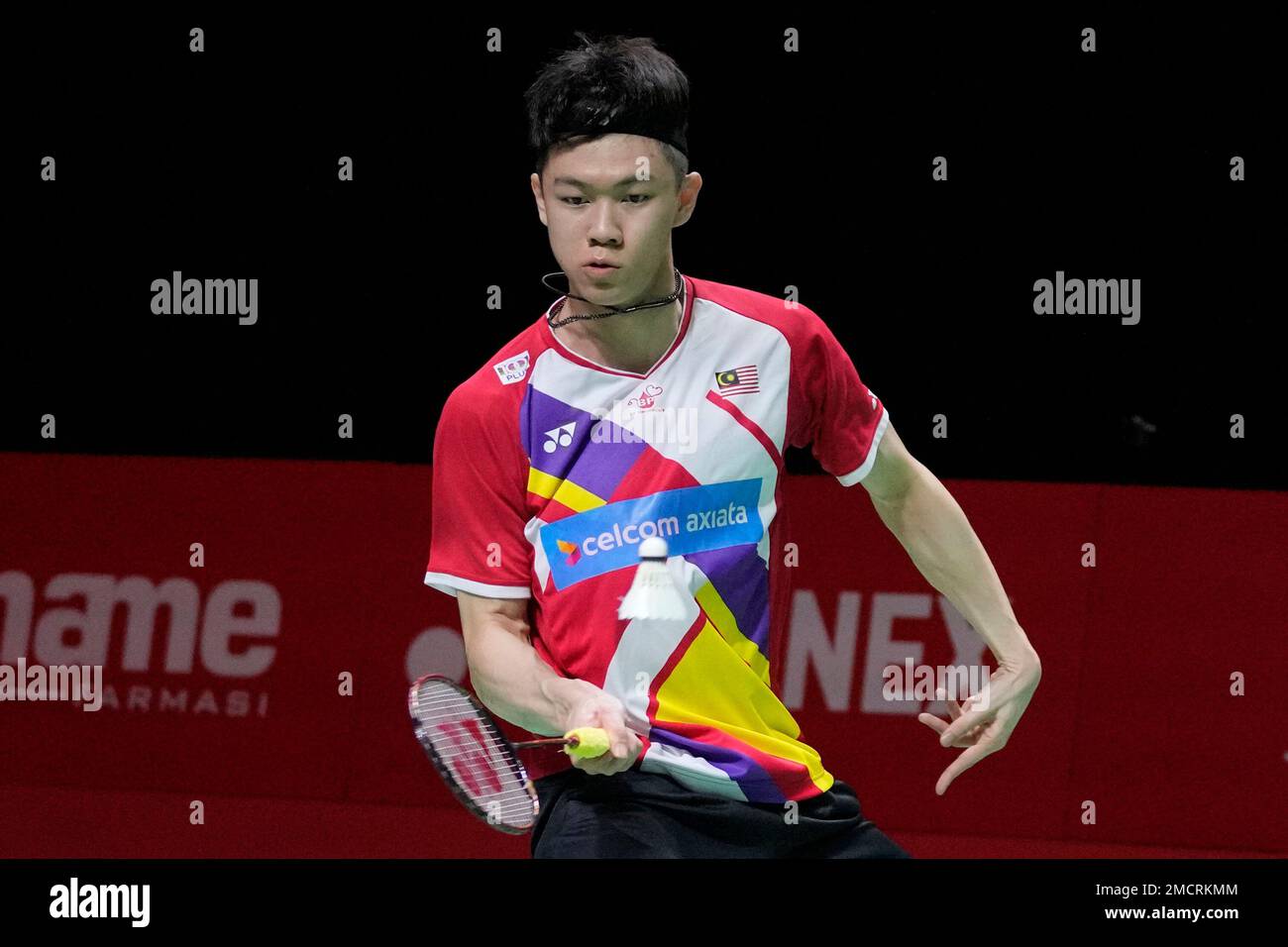 Malaysias Lee Zii Jia competes against France Toma Junior Popov during their mens singles badminton group stage match at the BWF World Tour Finalsin Nusa Dua, Bali, Indonesia, Thursday, Dec