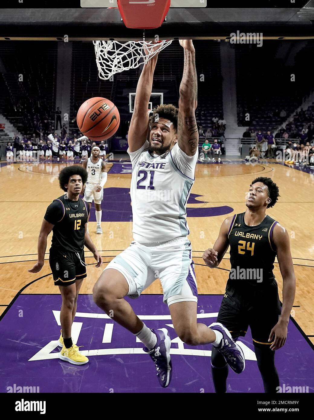 Kansas State's Davion Bradford (21) gets past Albany's Paul Newman (24
