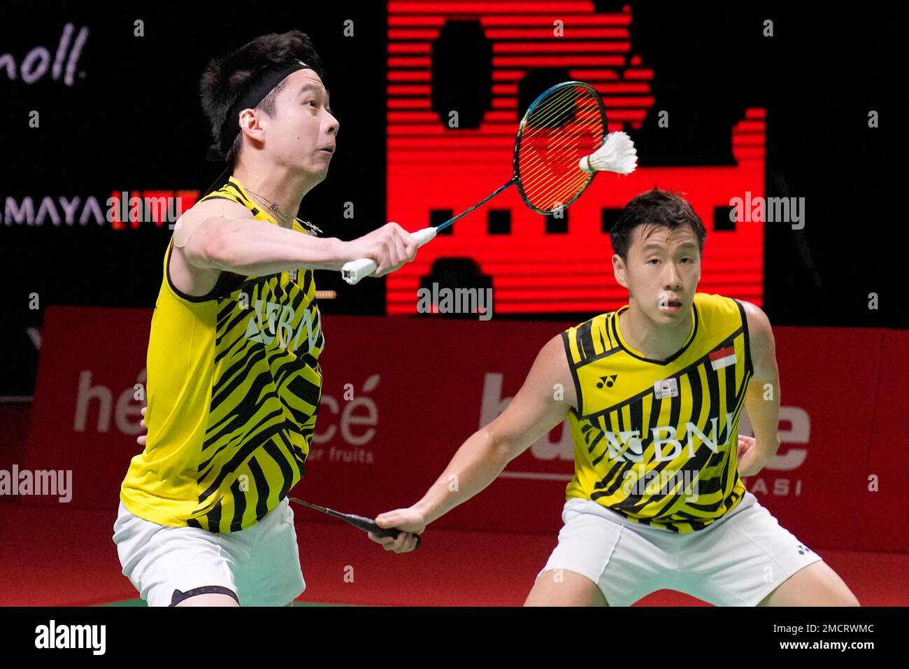 Indonesias Kevin Sanjaya Sukamuljo, left, and Marcus Gideon compete against Taiwans Lee Yang and Wang Chi Lin compete during their mens doubles Group A badminton match at the BWF World Tour Finals