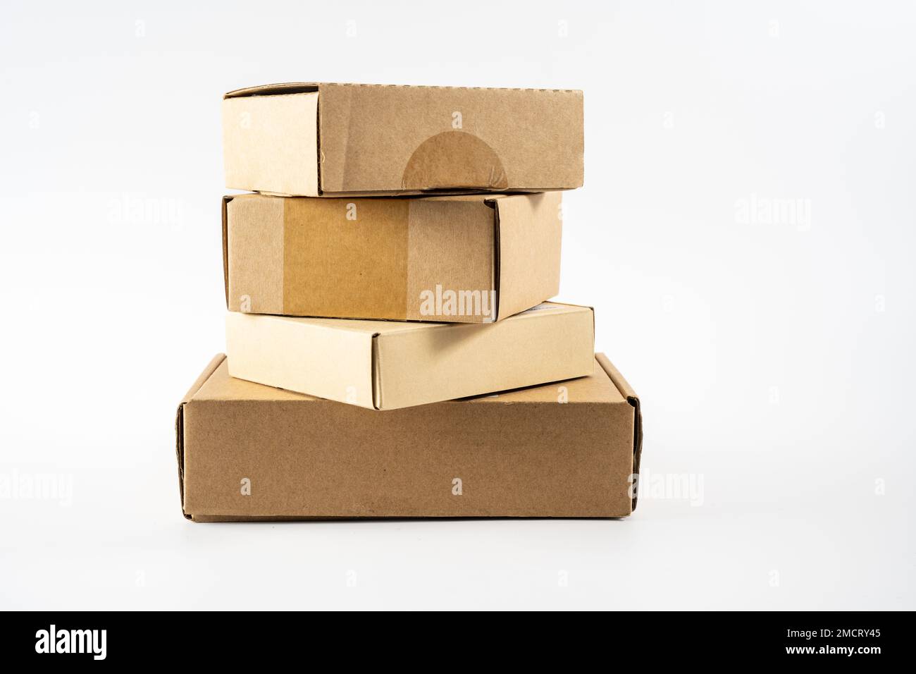 stack of used cardboard mailling storage boxes ready for recycling into