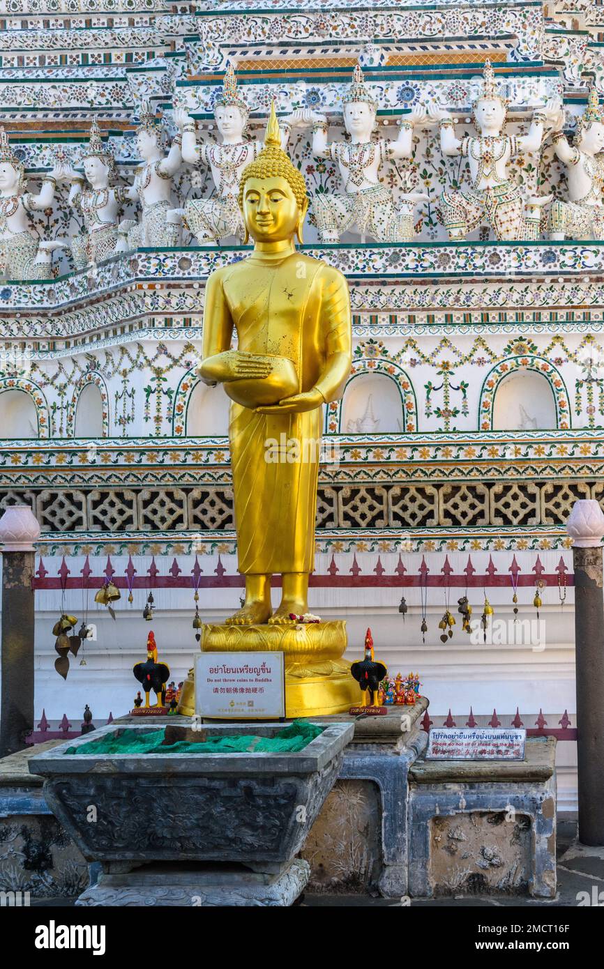 Bangkok, Thailand March 19th 2018 A gold statue at the base of the