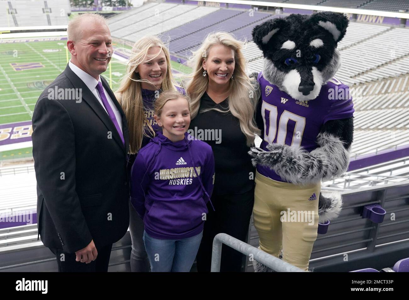 Kalen DeBoer, left, poses for a photo with his wife Nicole, and his(08)