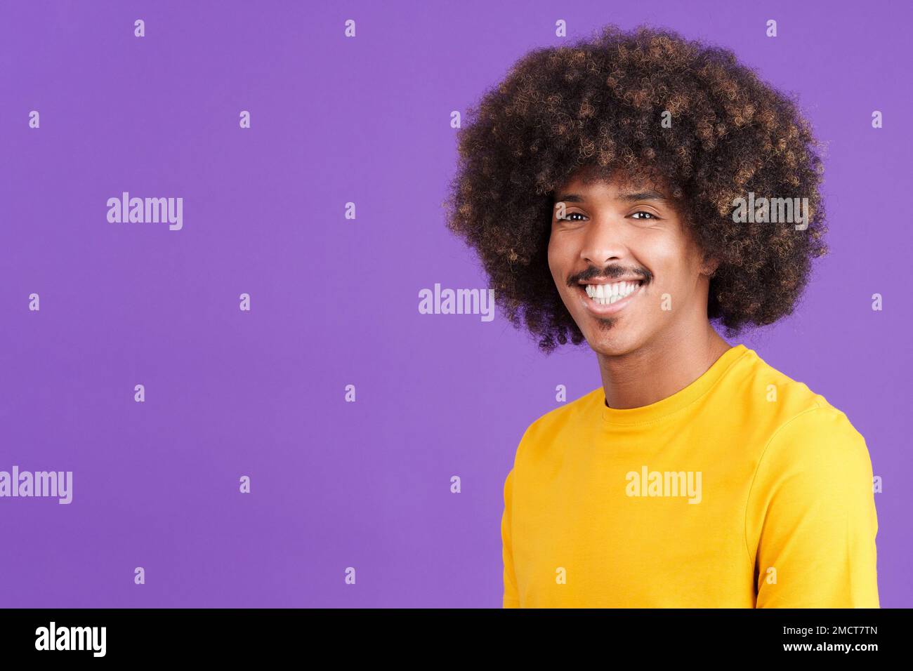 African man smiling while looking at camera Stock Photo