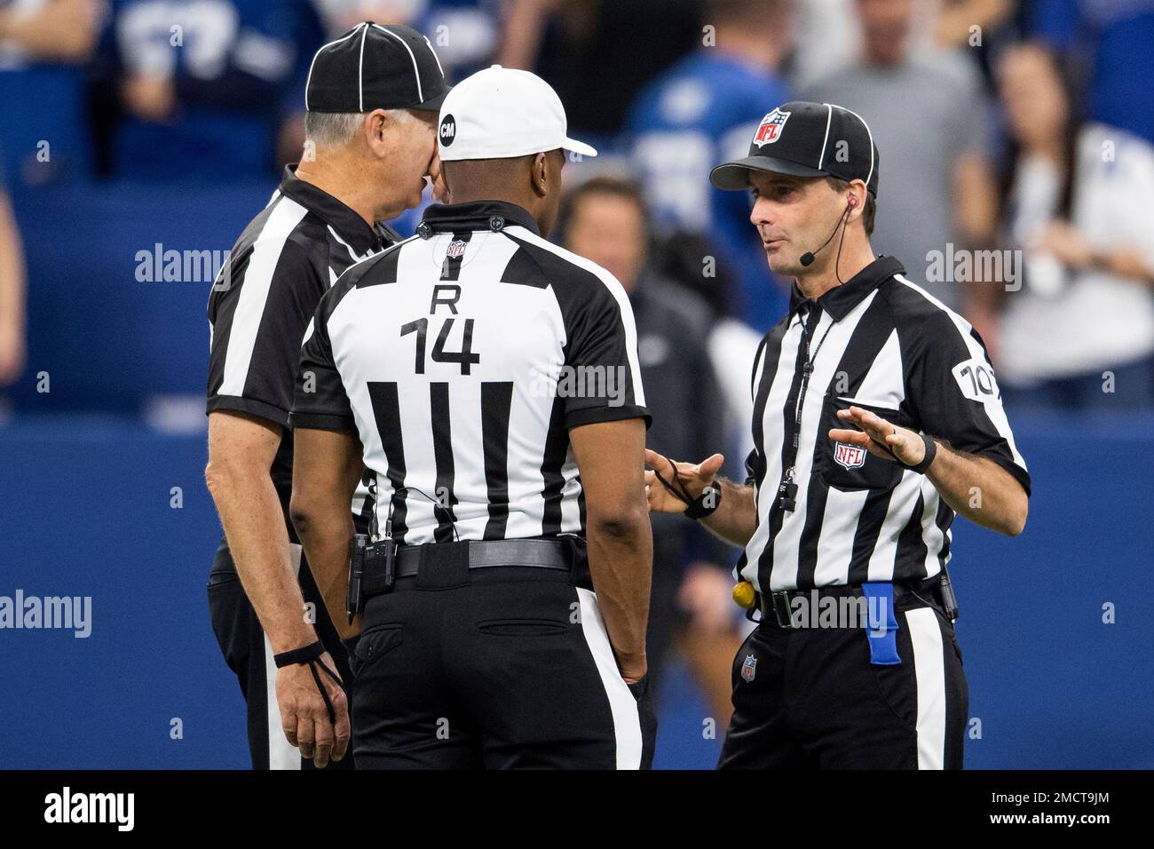 NFL referee Shawn Smith (14) talks to NFL side judge Dave Hawkshaw (107
