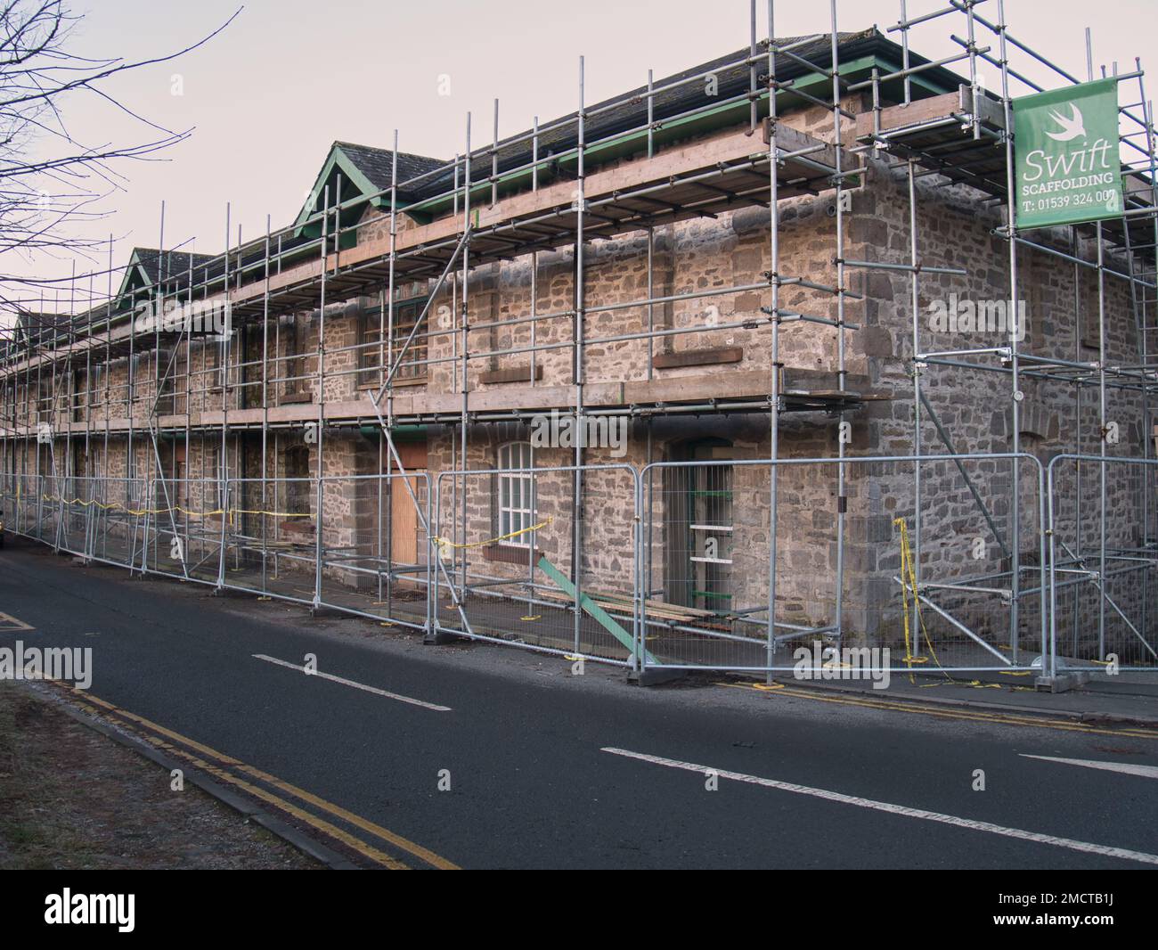 Scaffolding around the old Homebase store next to the River Kent during