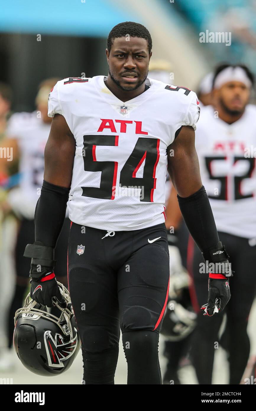 Atlanta Falcons linebacker Foyesade Oluokun (54) walks the sideline during  an NFL football game against the Jacksonville Jaguars, Sunday, Nov. 28, 2021,  in Jacksonville, Fla. (AP Photo/Gary McCullough Stock Photo - Alamy