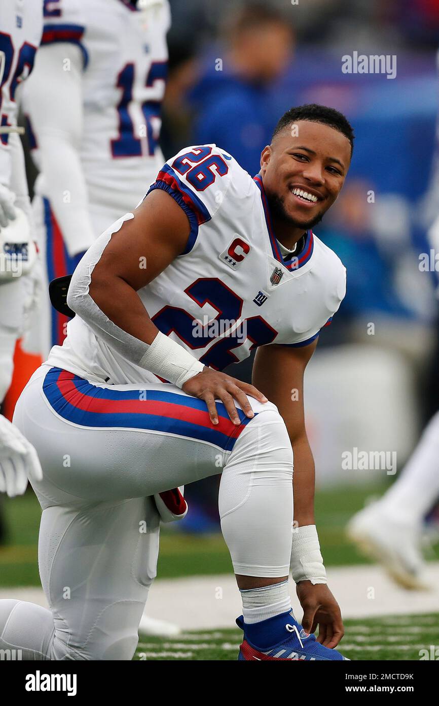 New York Giants running back Saquon Barkley warms up on the field