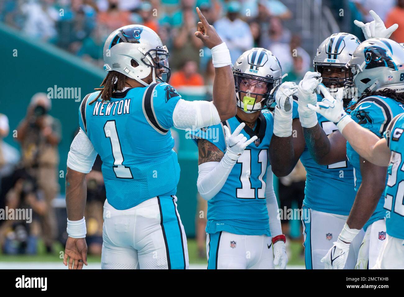 Carolina Panthers quarterback Cam Newton (1) celebrates scoring a touchdown  Carolina Panthers wide receiver Robby Anderson (11) during an NFL football  game against the Miami Dolphins, Sunday, Nov. 28, 2021, in Miami