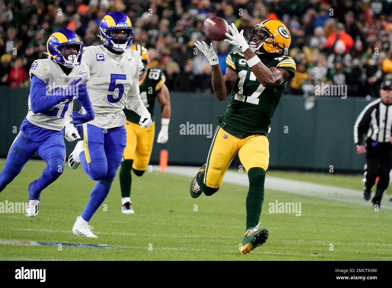 Green Bay Packers' Davante Adams catches a long pass in front of Los ...