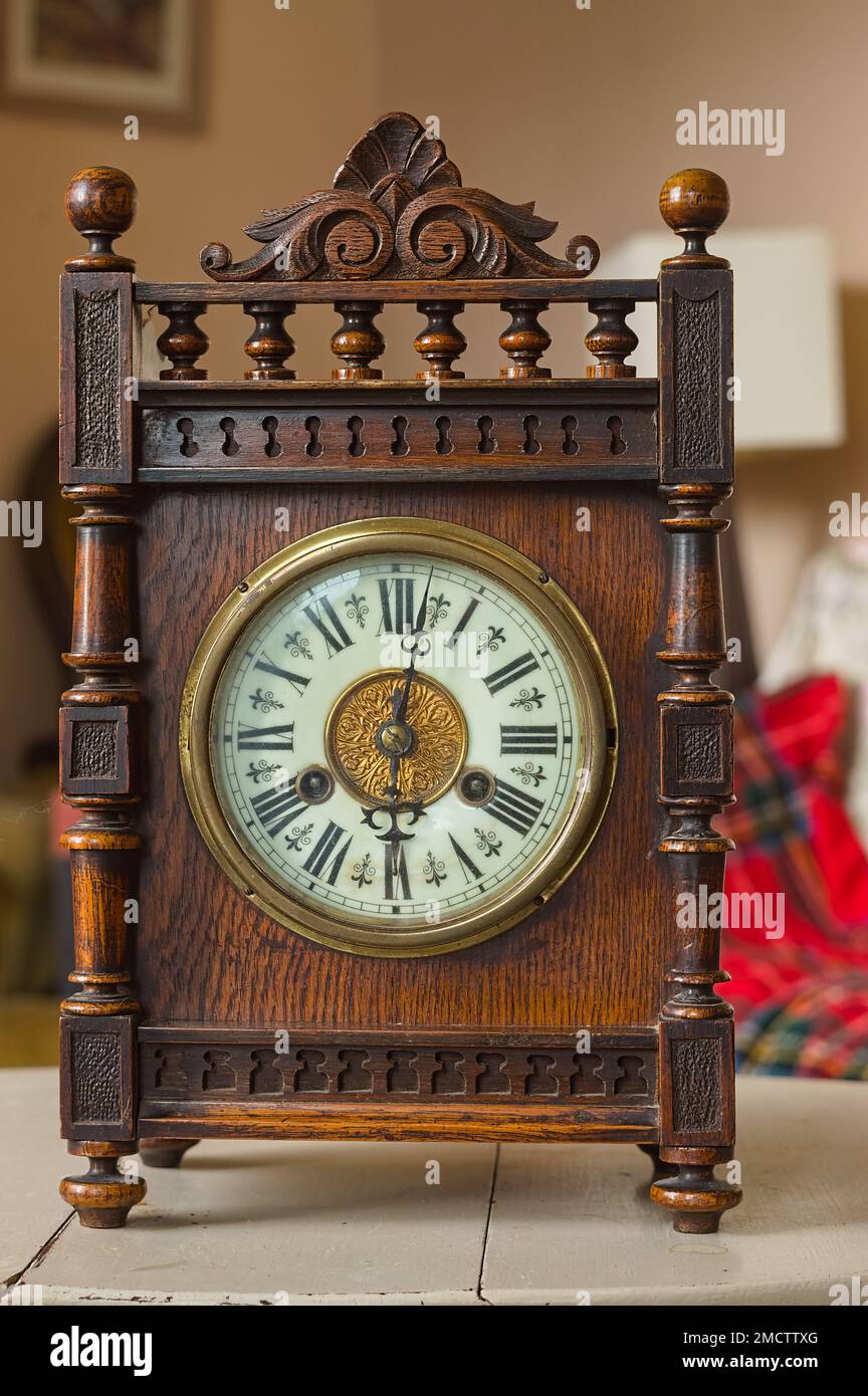 Antique mahogany mantle clock in the home Stock Photo Alamy