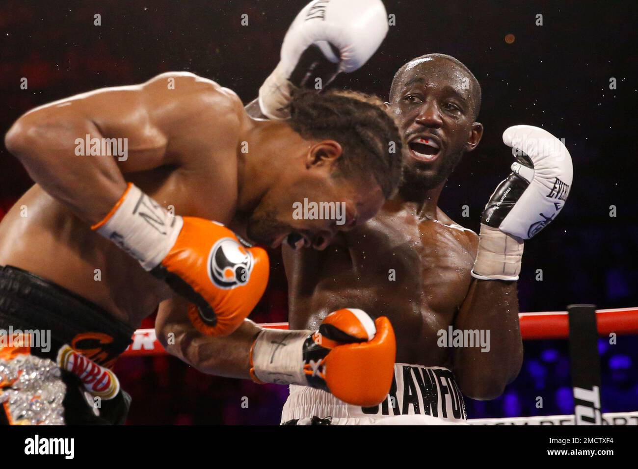Terence Crawford, right, fights Shawn Porter during a welterweight