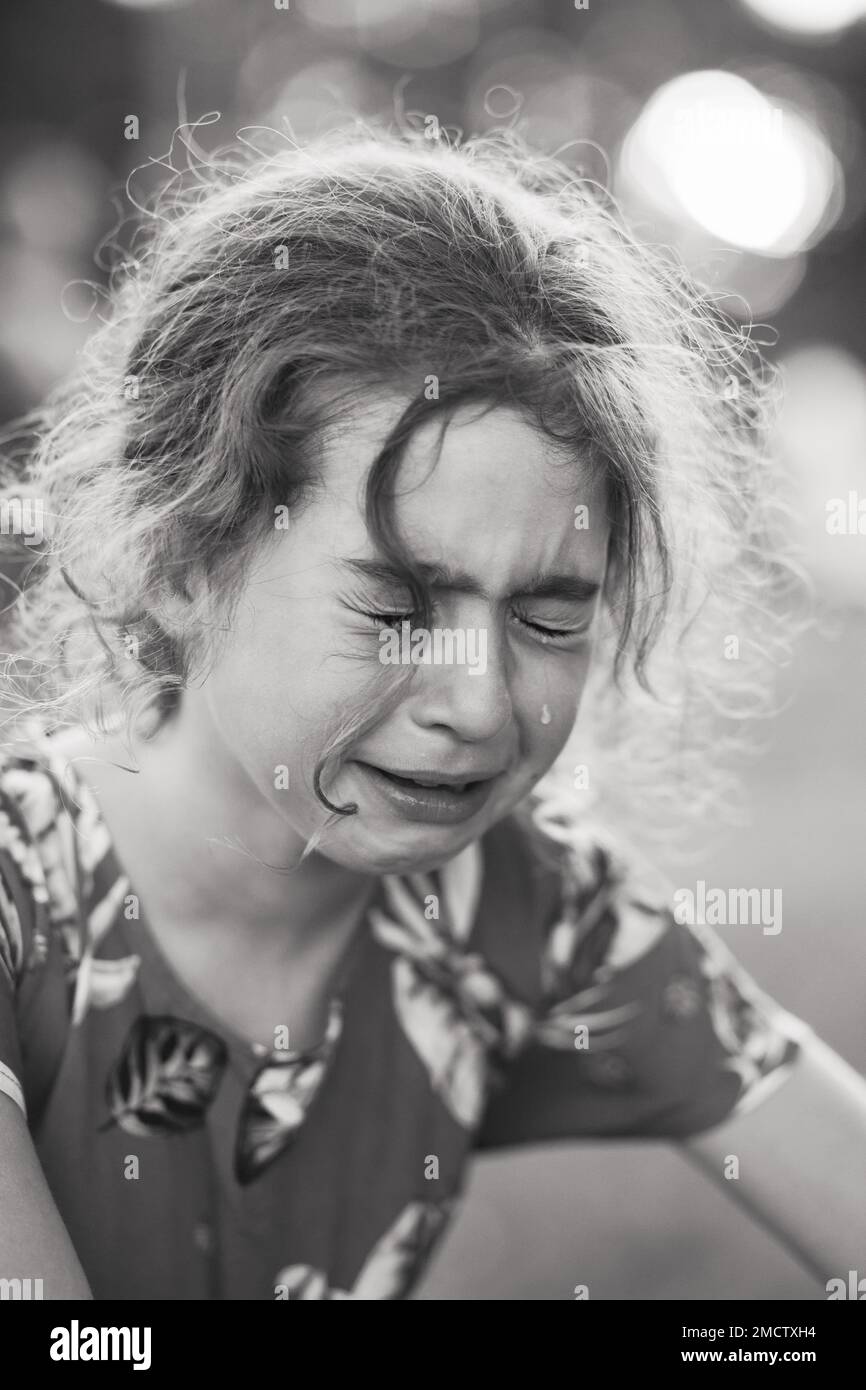 Black and white Portrait of crying sad little girl Stock Photo
