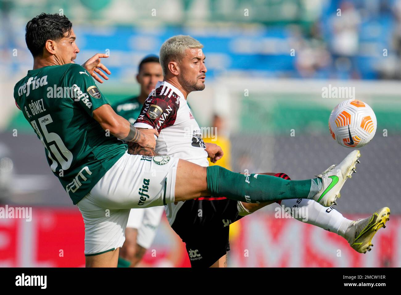 Gustavo Gomez of Brazil's Palmeiras heads the ball challenged by Carlos  Carmona of Chile's Colo Colo, right, during a quarter final second leg Copa Libertadores  soccer match in Sao Paulo, Brazil, Wednesday