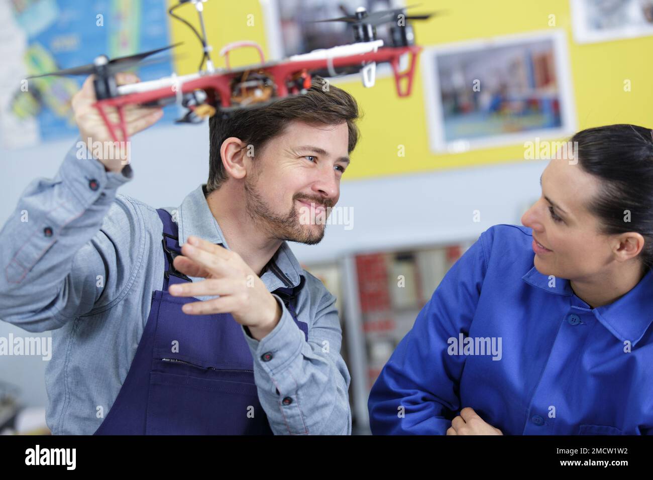 couple playing with a small drone Stock Photo - Alamy