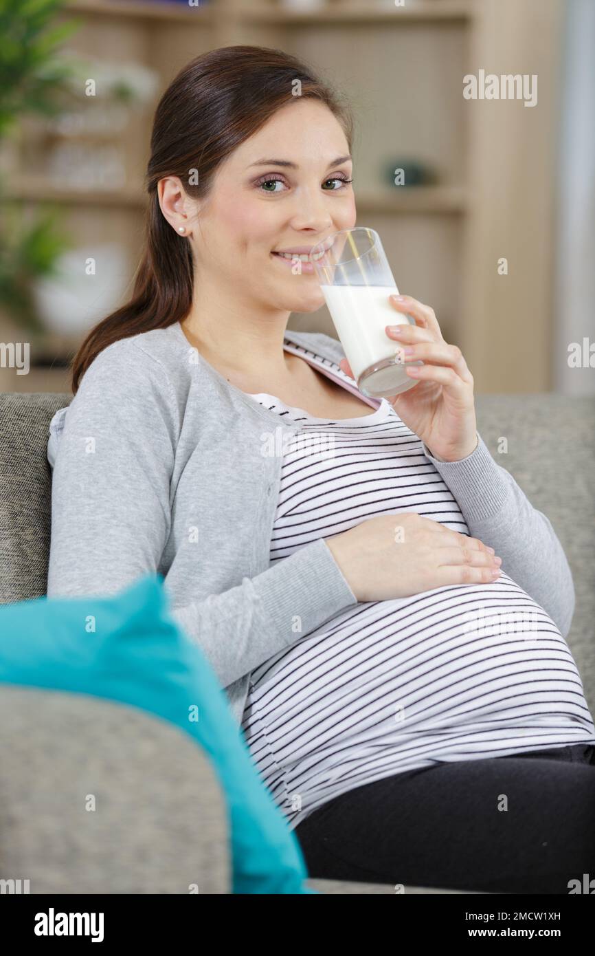 happy pregnant woman drinking milk Stock Photo Alamy