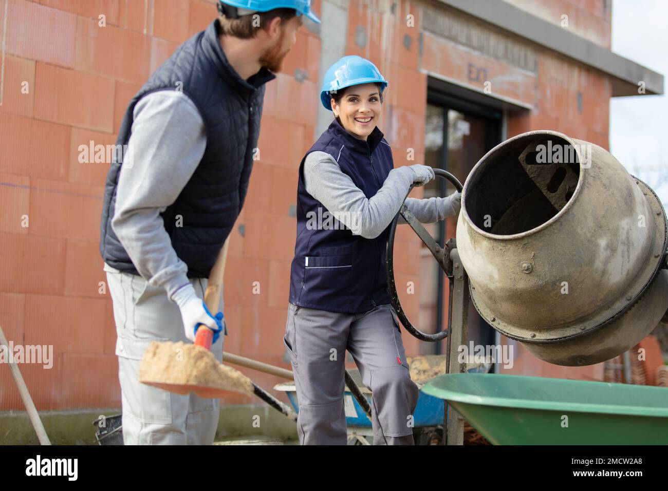 portrait of female and male workers at building site Stock Photo