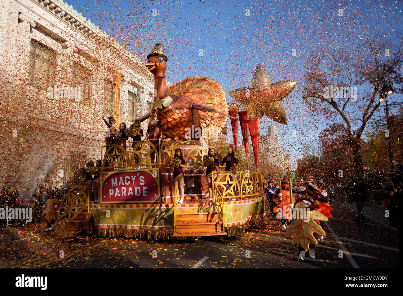 The tom turkey float rides down central park west in the macy s