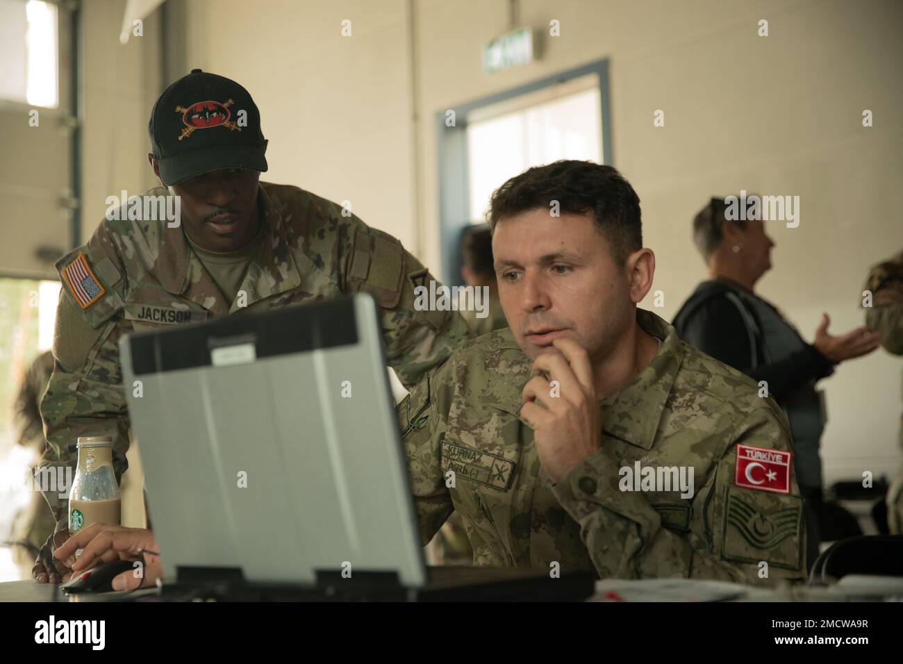 A U.S. Army observer coach trainer (OCT) from the Joint Multinational ...