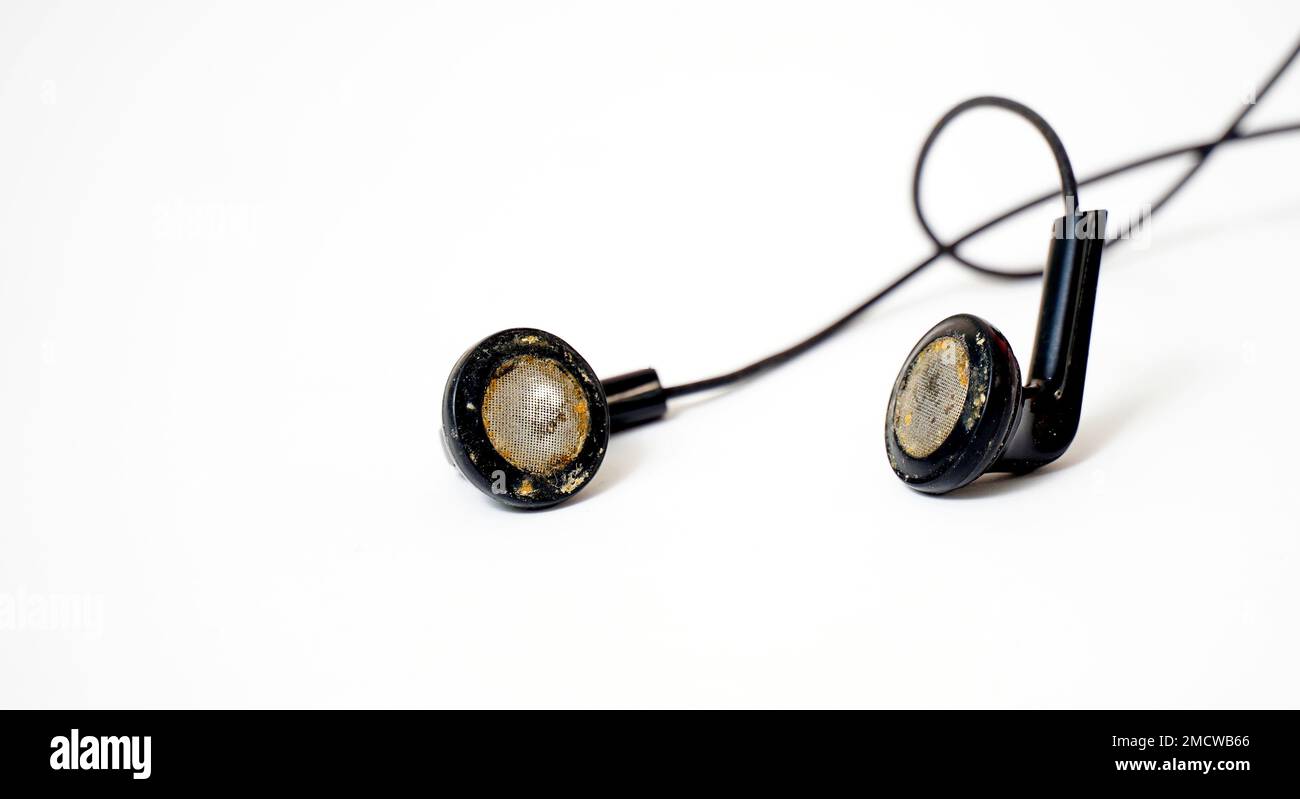 dirty and dusty used black ear buds isolated on white background Stock Photo Alamy