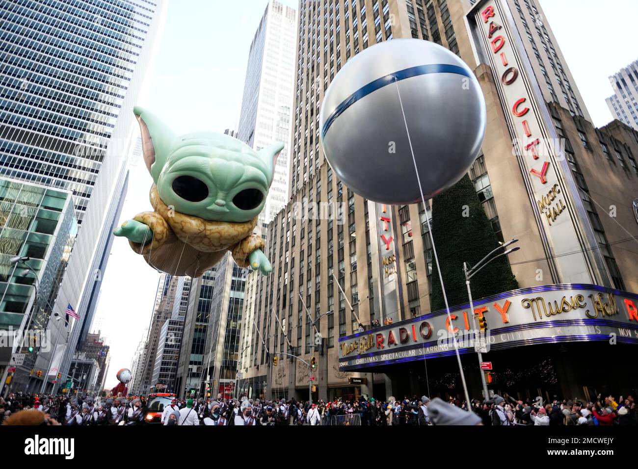 The Grogu or Baby Yoda balloon floats in the Macy's Thanksgiving Day