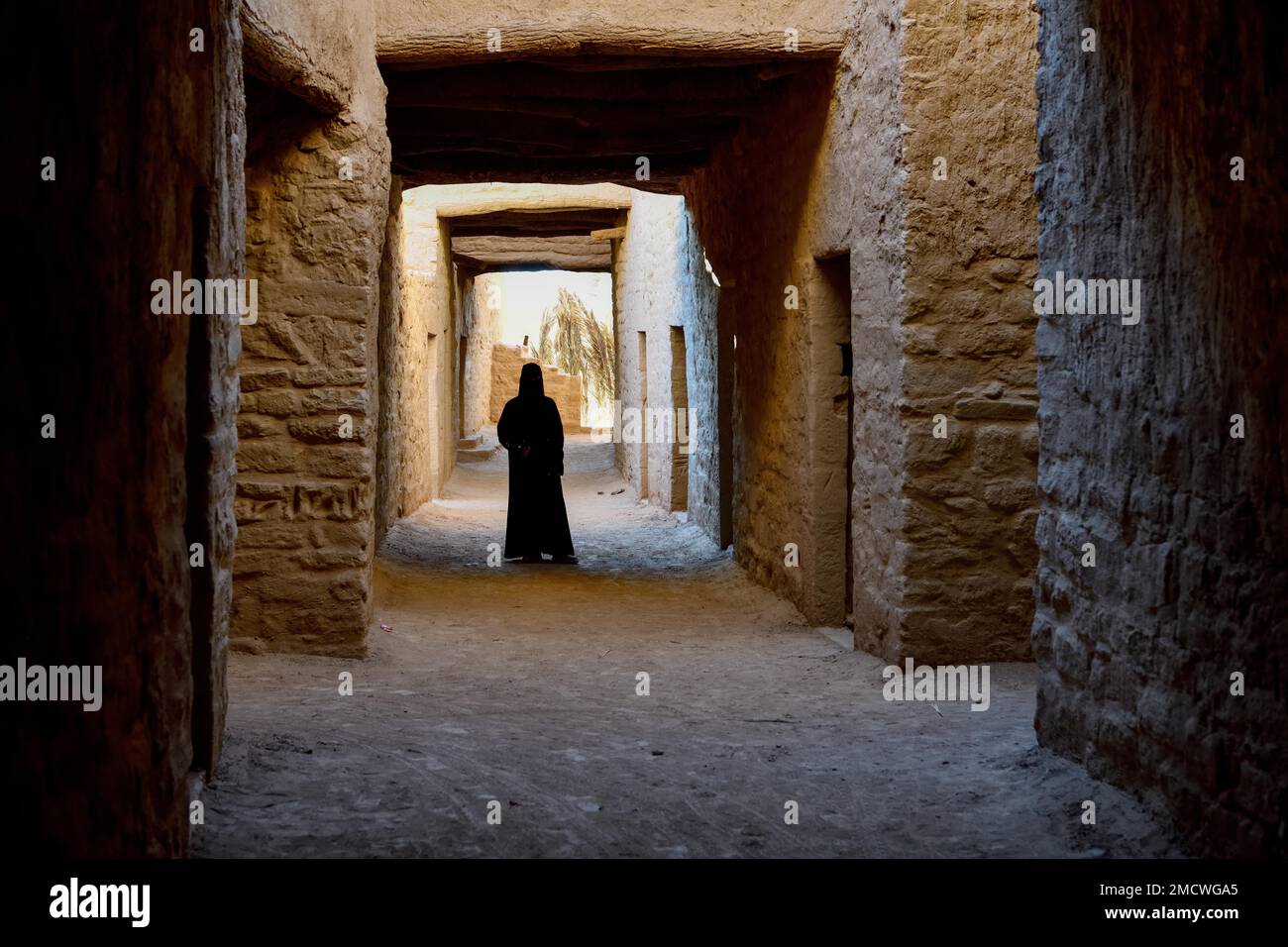 Local Veiled Woman in the Old City of AlUla, Medina Province, Saudi Arabia, Arabian Peninsula Stock Photo