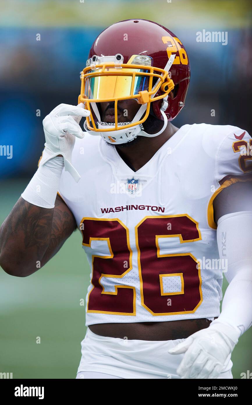 Washington Football Team safety Landon Collins 26 walks off the field following warm ups prior to an NFL football game against the Carolina Panthers Sunday Nov. 21 2021 in Charlotte N.C. AP