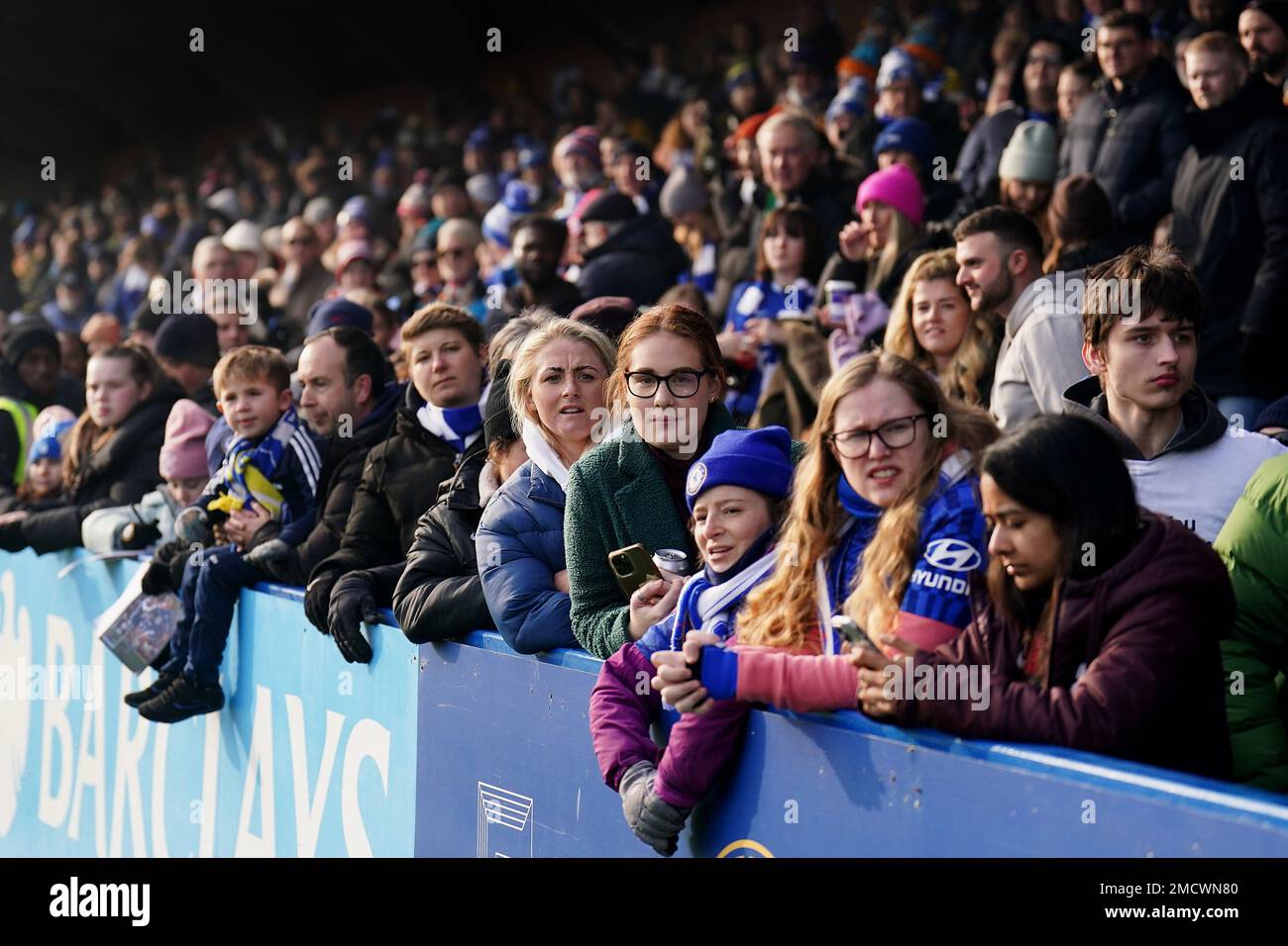 Fans watch on during the Barclays Women's Super League match at Kingsmeadow, London. Picture date: Sunday January 22, 2023. Stock Photo