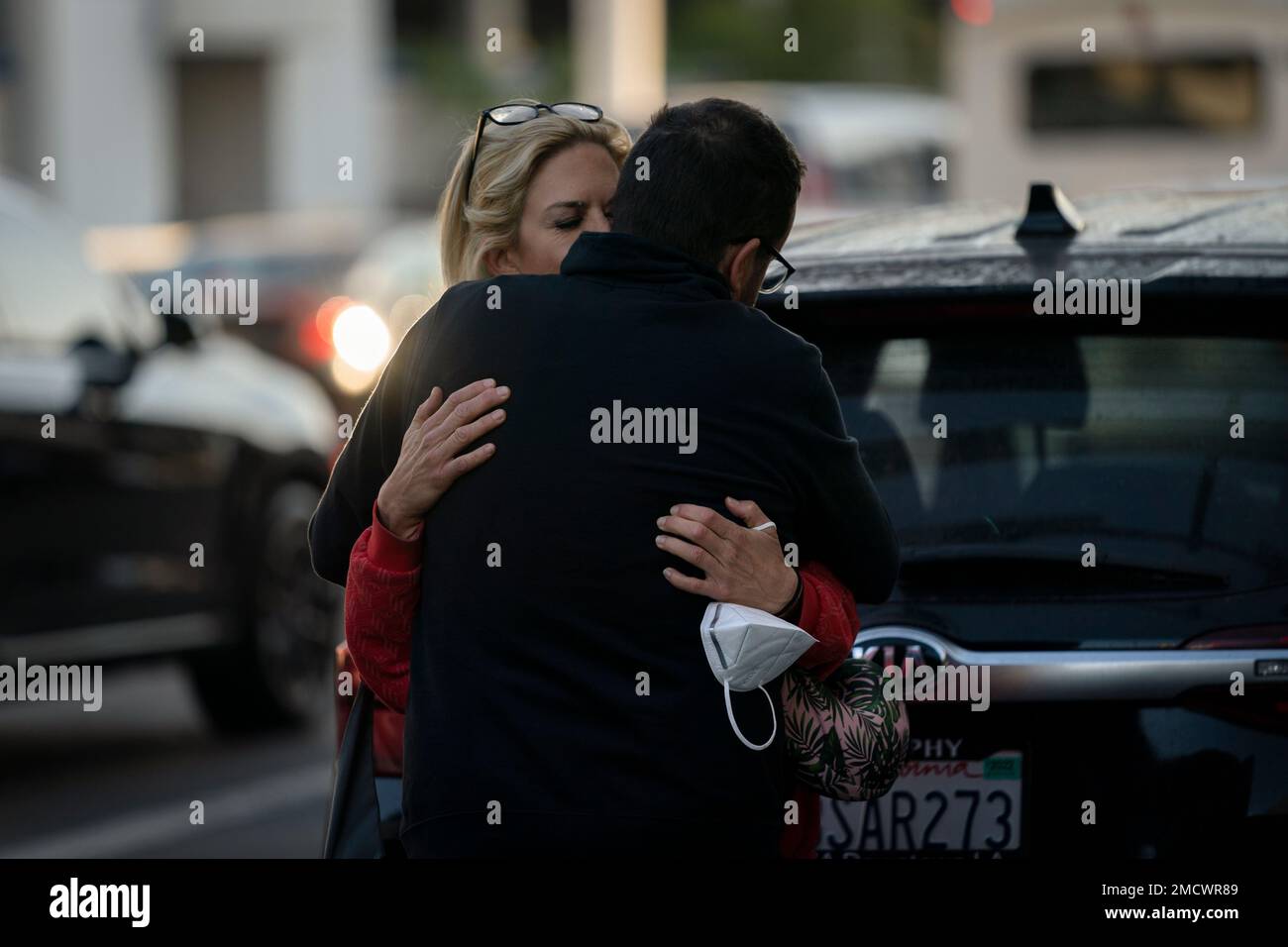 Traveling to Kansas City, Mo., Kate Krystowiak hugs her boyfriend, Jimmy  Bradley, after she was dropped off at the Los Angeles International Airport  in Los Angeles, Wednesday, Nov. 24, 2021. (AP PhotoJae