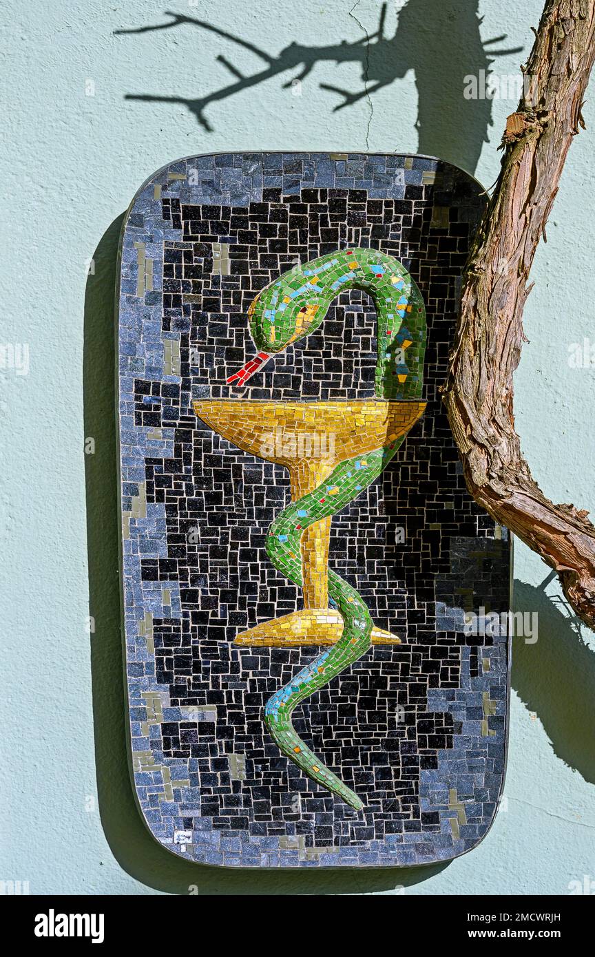 Mosaic pharmacy logo, snake with chalice, Lindau, Swabia, Bavaria, Germany Stock Photo