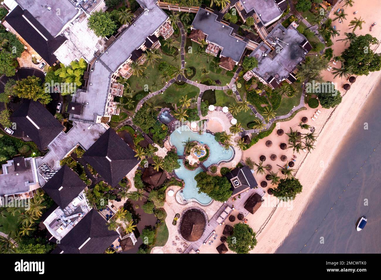 Aerial view, sunset on the coast of Flic en Flac, a river washes muddy