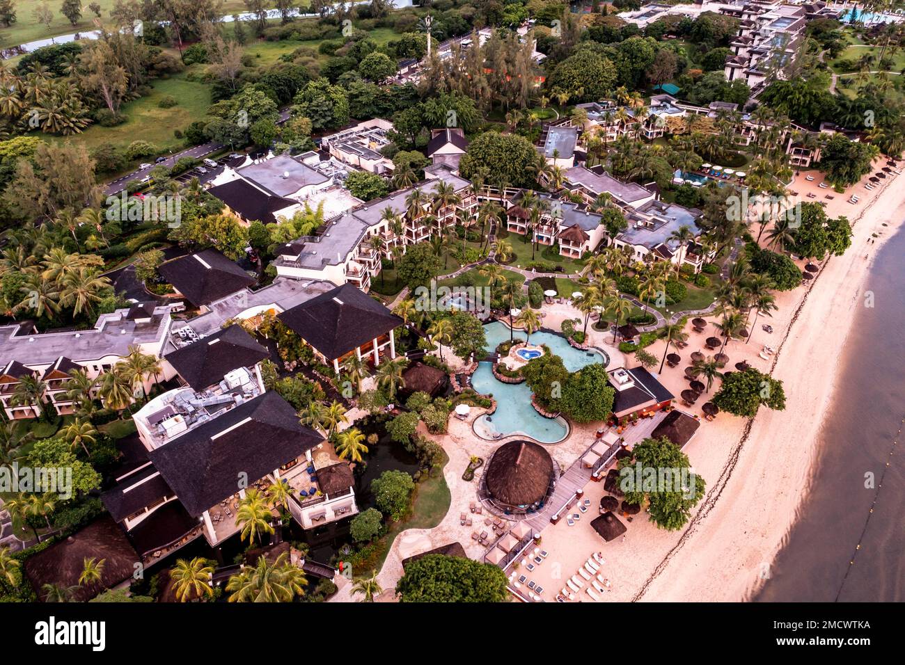 Aerial view, sunset on the coast of Flic en Flac, a river washes muddy