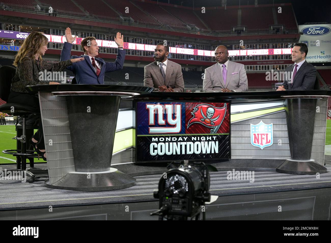 ESPN's Monday Night Countdown crew members Suzy Kolber, left to right,  Steve Young, Randy Moss, Booger McFarland and Adam Schefter work from the  field before an NFL football game between the Tampa