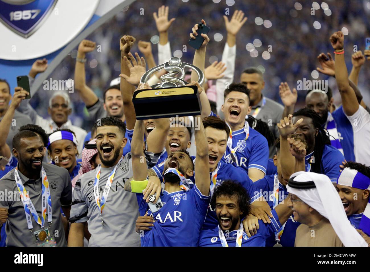 Saudi Arabia's Al Hilal soccer team players celebrate their trophy of the  AFC Champions League 2021 after the team beats South Korea's Pohang  Steelers 2-0 during their final soccermatch at the King