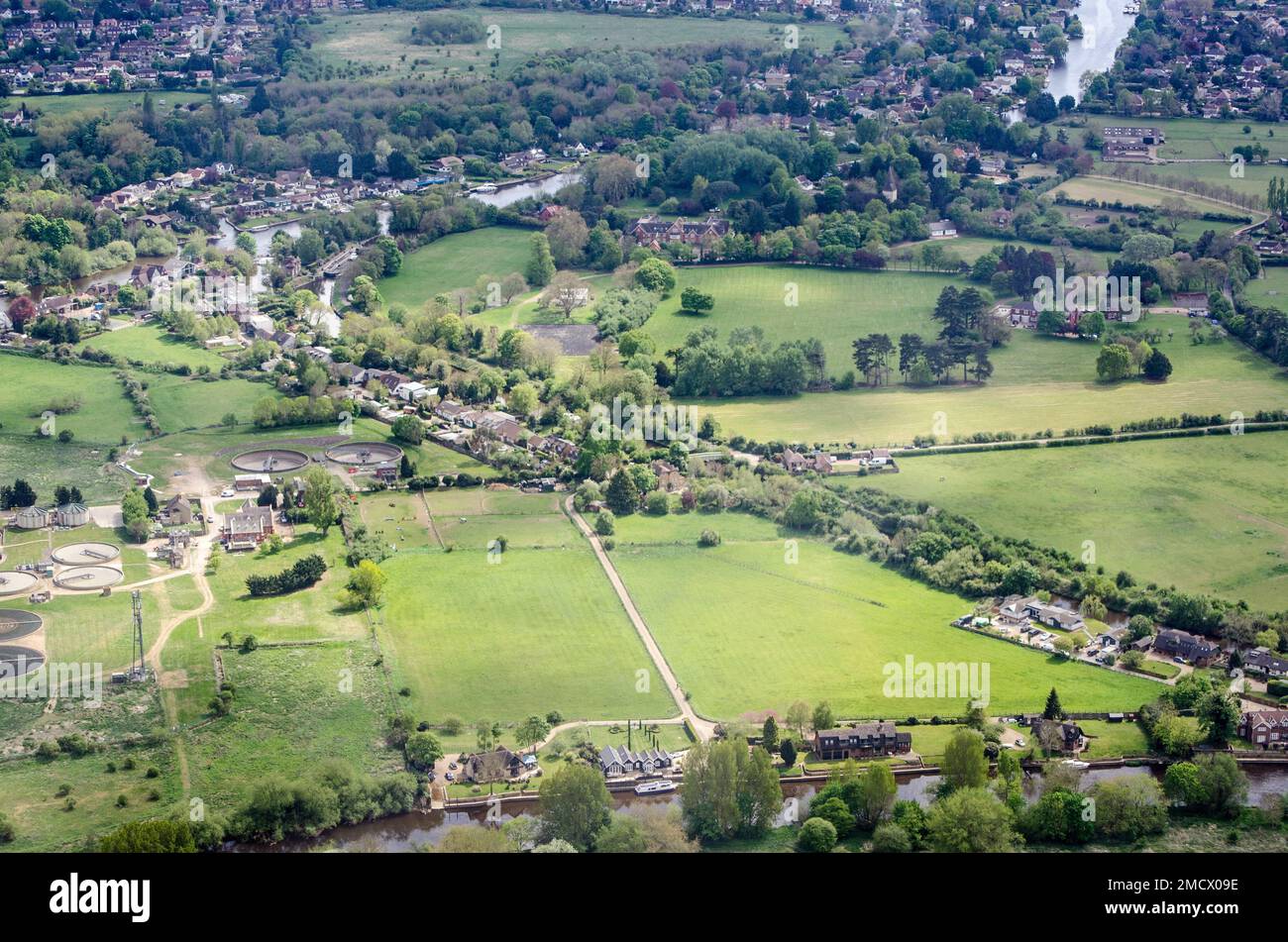 Aerial view of the Thames Water sewage treatment works at Ham Island in Old Windsor, Berkshire.  The water treatment site is on a bend of the River Th Stock Photo