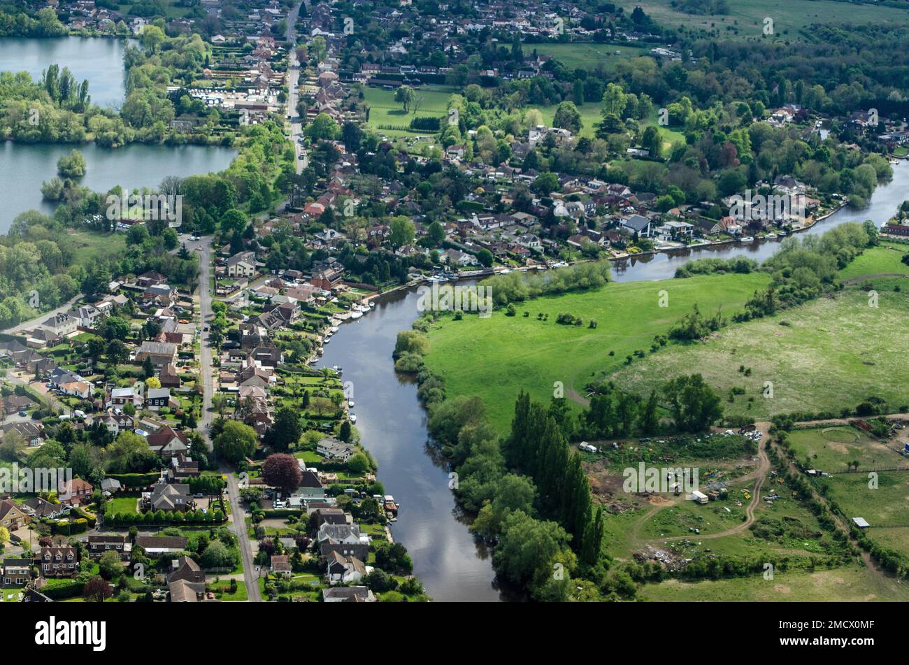 Aerial view of the houses bordering the River Thames at Sunnymeads, Berkshire on a spring afternoon. Stock Photo