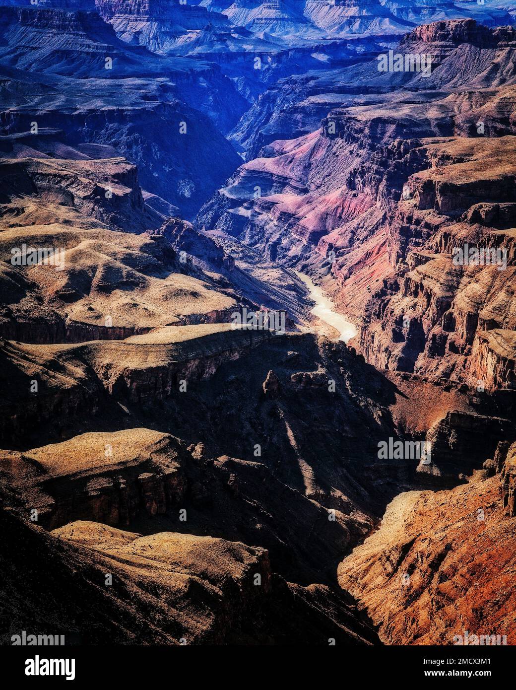 Almost a mile below the rim the Colorado River carves through the Grand Canyon in Arizona. Stock Photo