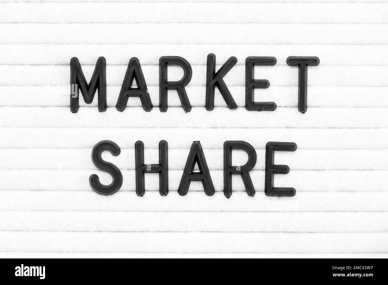 Black color letter in word market share on white felt board background ...