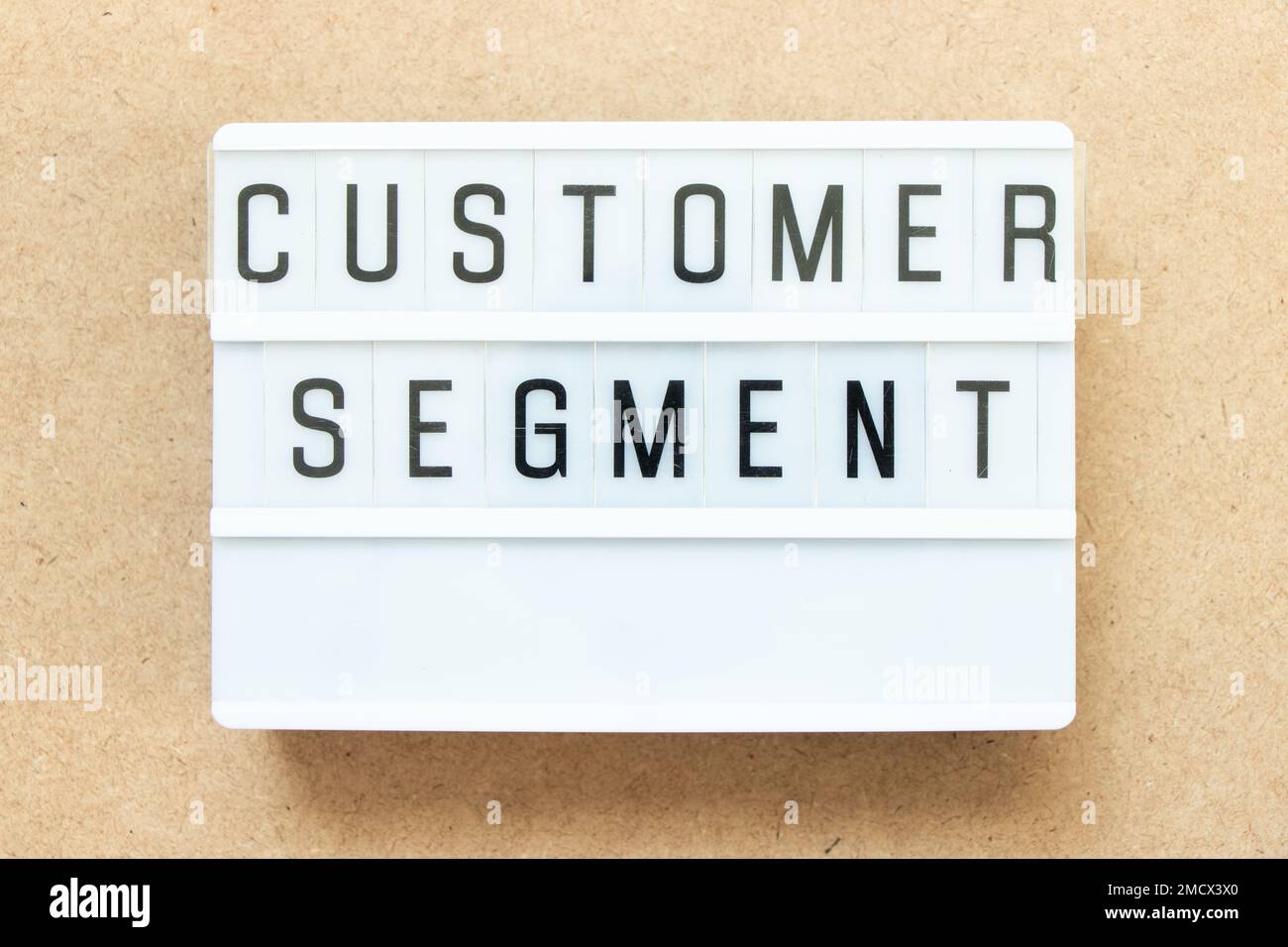 Lightbox with word customer segment on wood background Stock Photo Alamy