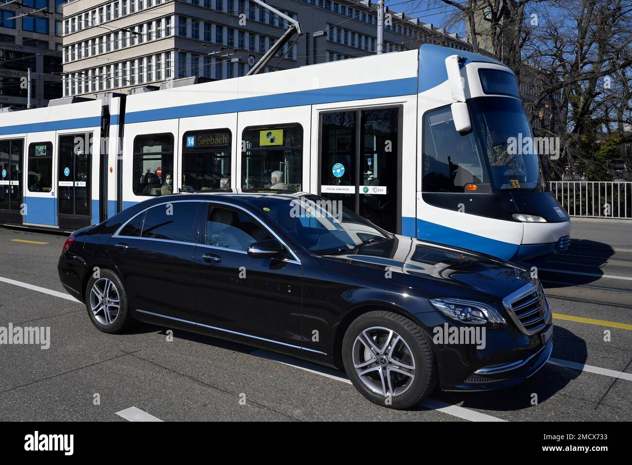 Road transport, passenger car and tram VBZ, Zurich, Switzerland Stock Photo