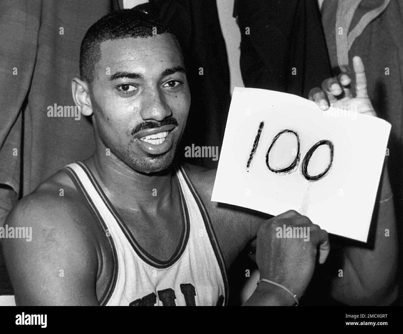 file-wilt-chamberlain-of-the-philadelphia-warriors-holds-a-sign