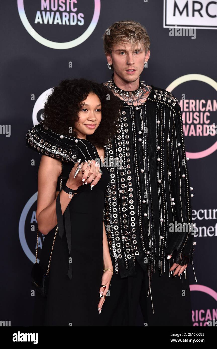 Casie Colson Baker, left, and Machine Gun Kelly arrive at the American
