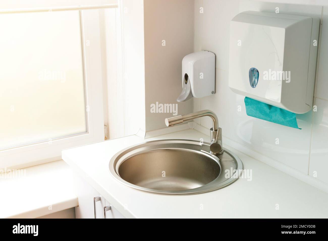 Modern hospital ward, hand washing sink, automatic dispenser with soap